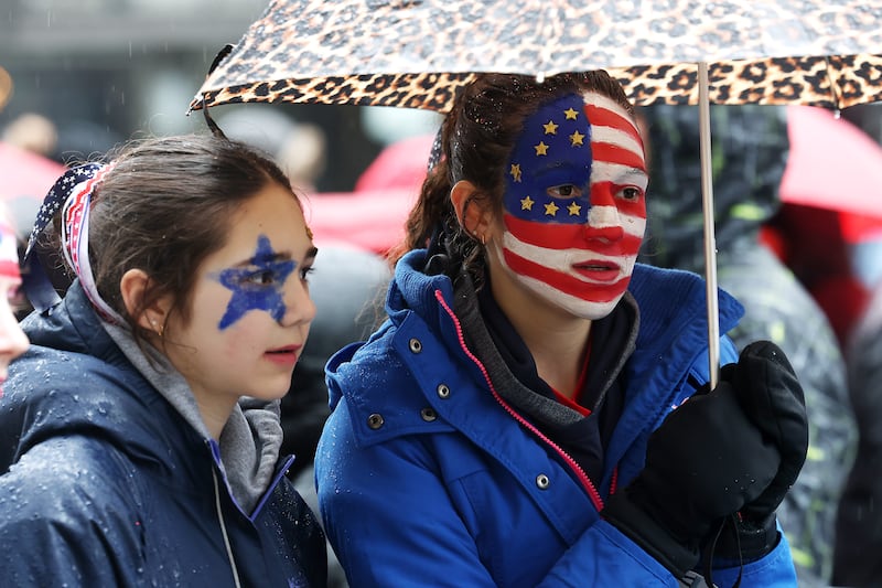 Supporters wait in line at Capital One Arena for Donald Trump's victory rally in Washington, DC on Sunday. Photograph: Joe Raedle/Getty Images