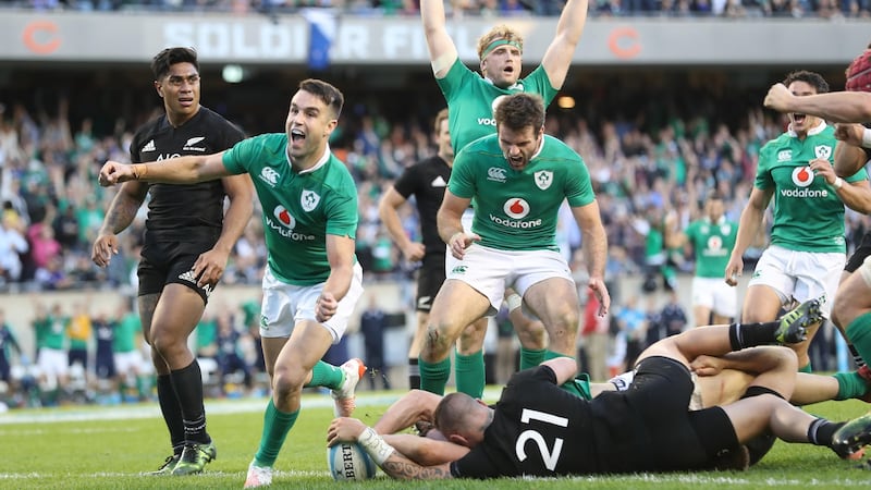 Conor Murray, Jared Payne and Jamie Heaslip celebrate Robbie Henshaw’s try, which sealed Ireland’s victory over New Zealand at Soldier Field – their first over the All Blacks in 111 years. Photograph: Billy Stickland/Inpho