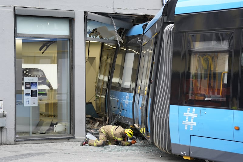 An emergency worker takes evidence after a tram crashed into a building in Oslo, Norway. Photograph: TERJE PEDERSEN/NTB/AFP via Getty Images