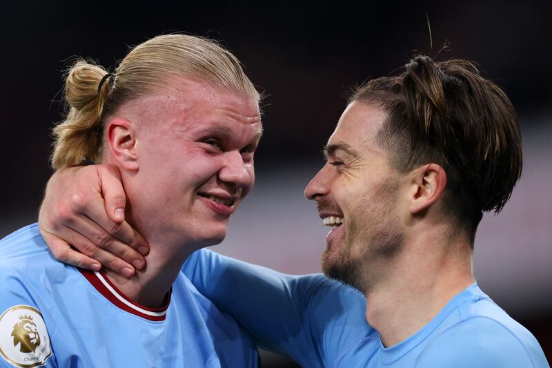 Stats entertainment: Erling Haaland and Jack Grealish, possibly discussing the notion that Haaland has made Man City worse. Photograph: Marc Atkins/Getty Images