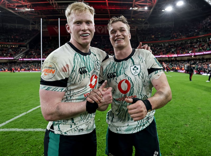 Ireland's Jamie Osborne and Josh van der Flier were in jubilant mood after a hard-earned win in Wales. Photograph: Dan Sheridan/Inpho