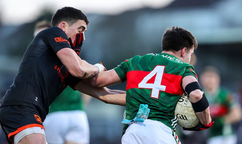 Mayo's Enda Hession is tackled by Armagh's Rory Grugan. Photograph: Nick Elliott/Inpho