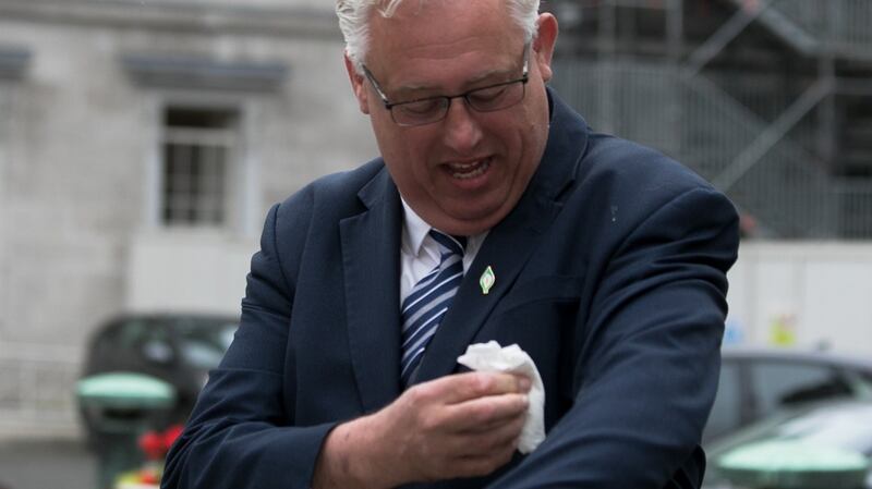 Sinn Féin spokesperson on addiction, recovery and wellbeing Thomas Gould TD wipes bird poo from his suit during the launch of  his  party’s Community Addiction and Recovery Strategy. Photograph: Gareth Chaney/Collins