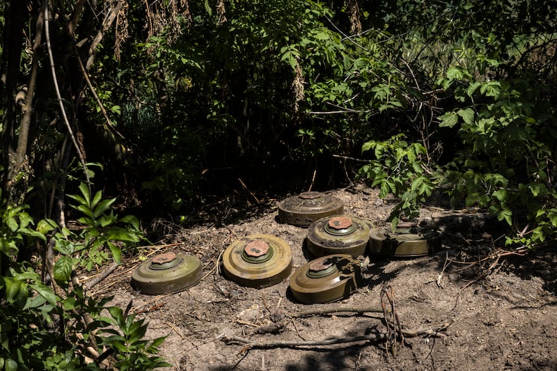 Six mines in Novodarivka. To gain ground, Ukrainian forces have to make their way through a variety and density of Russian land mines they never imagined. Photograph: David Guttenfelder/The New York Times
                      