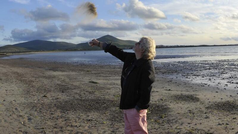 Billy MacGill scatters Brian’s ashes to the winds. Photographs: RM Hudson