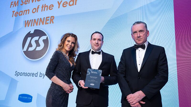 Martin McNally, head of smoke ventilation and service at Williaam Cox, presents the FM Service Provider Team of the Year award to Gill McDonald and David Hogan, ISS Facility Services - Ireland.