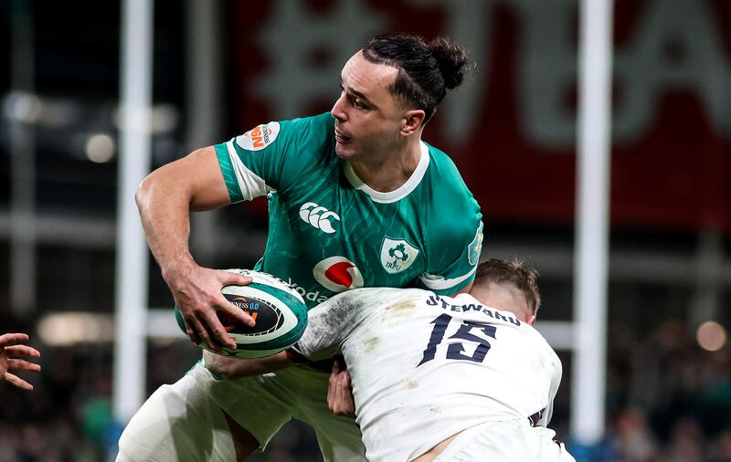 Ireland's James Lowe looks to get a pass away while being tackled by England's Freddie Steward. Photograph: Evan Treacy/PA Wire