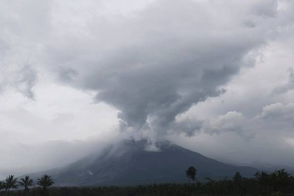 Indonesia volcano continues to spew ash as death toll rises to 22