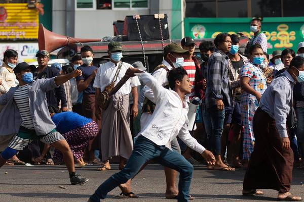 Supporters of Myanmar military attack coup protesters in Yangon