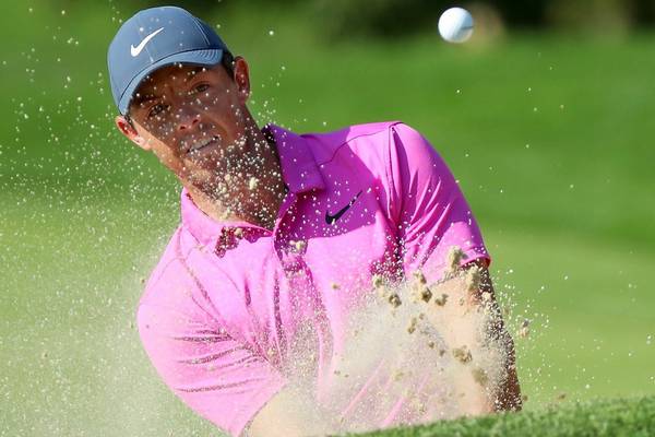 McIlroy and Woods toil but finish within striking distance in Ohio