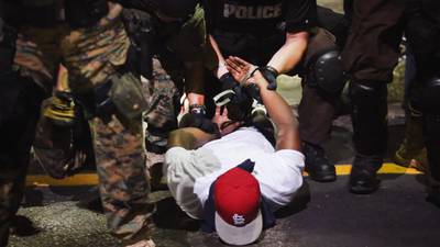 Ferguson police routinely violated black rights, report finds