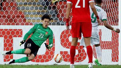 Ballboy helps China goalkeeper save from the spot
