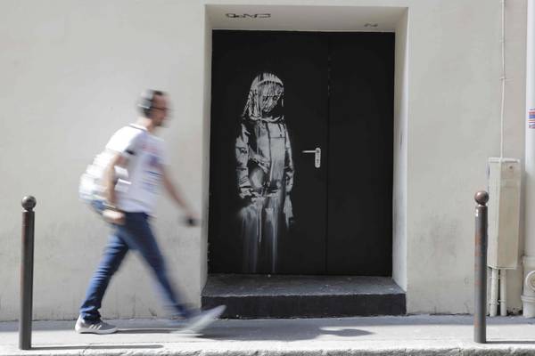 Banksy mural on fire door at Bataclan theatre in Paris