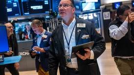 Global stocks edge higher as investors await earnings reports