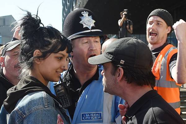 Image of woman standing up to far-right protester goes viral