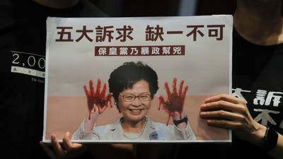 Hong Kong’s leader aborts annual policy speech amid protests